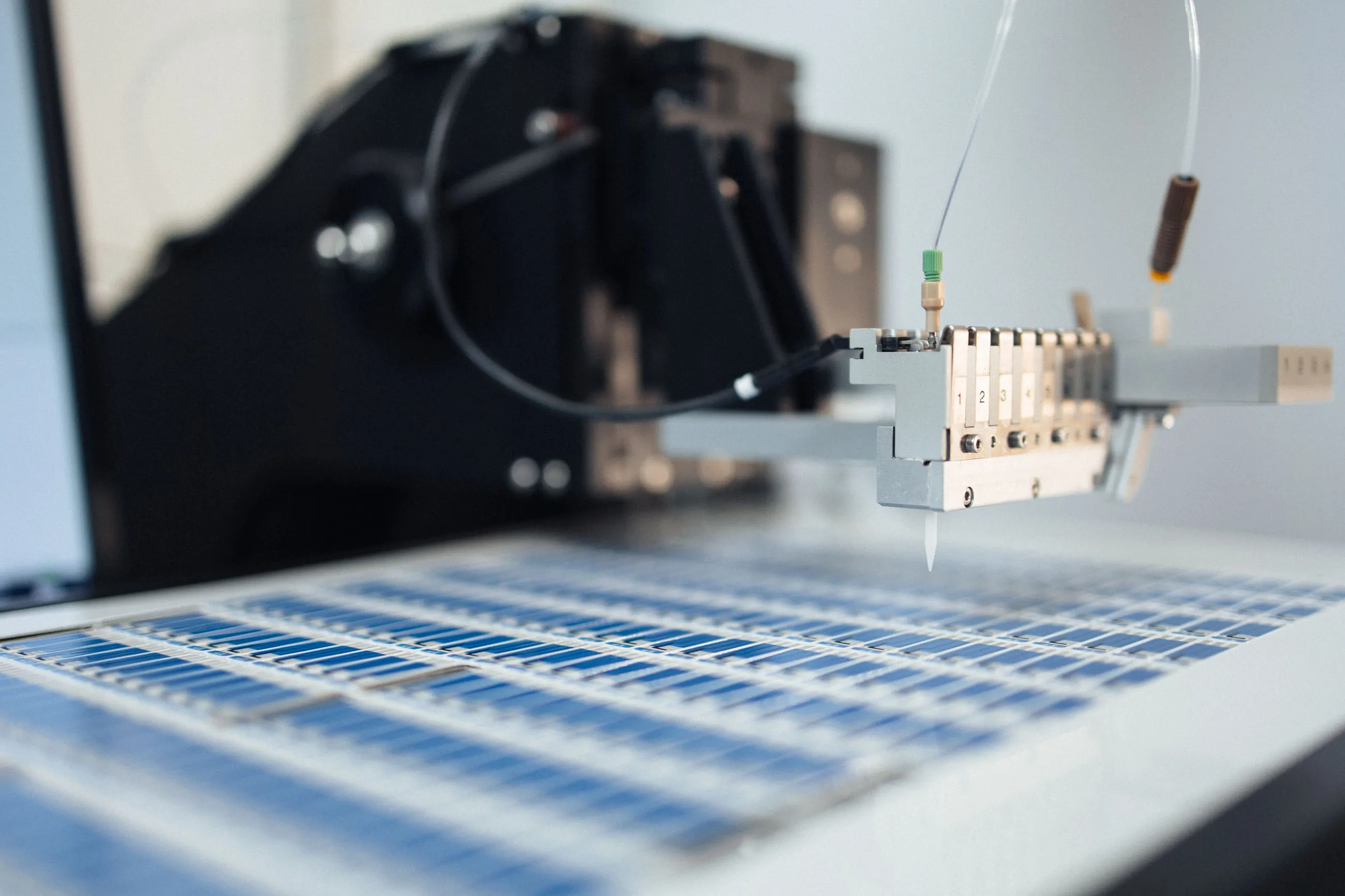 Scientist pipetting a biodot sample for electrochemical analysis